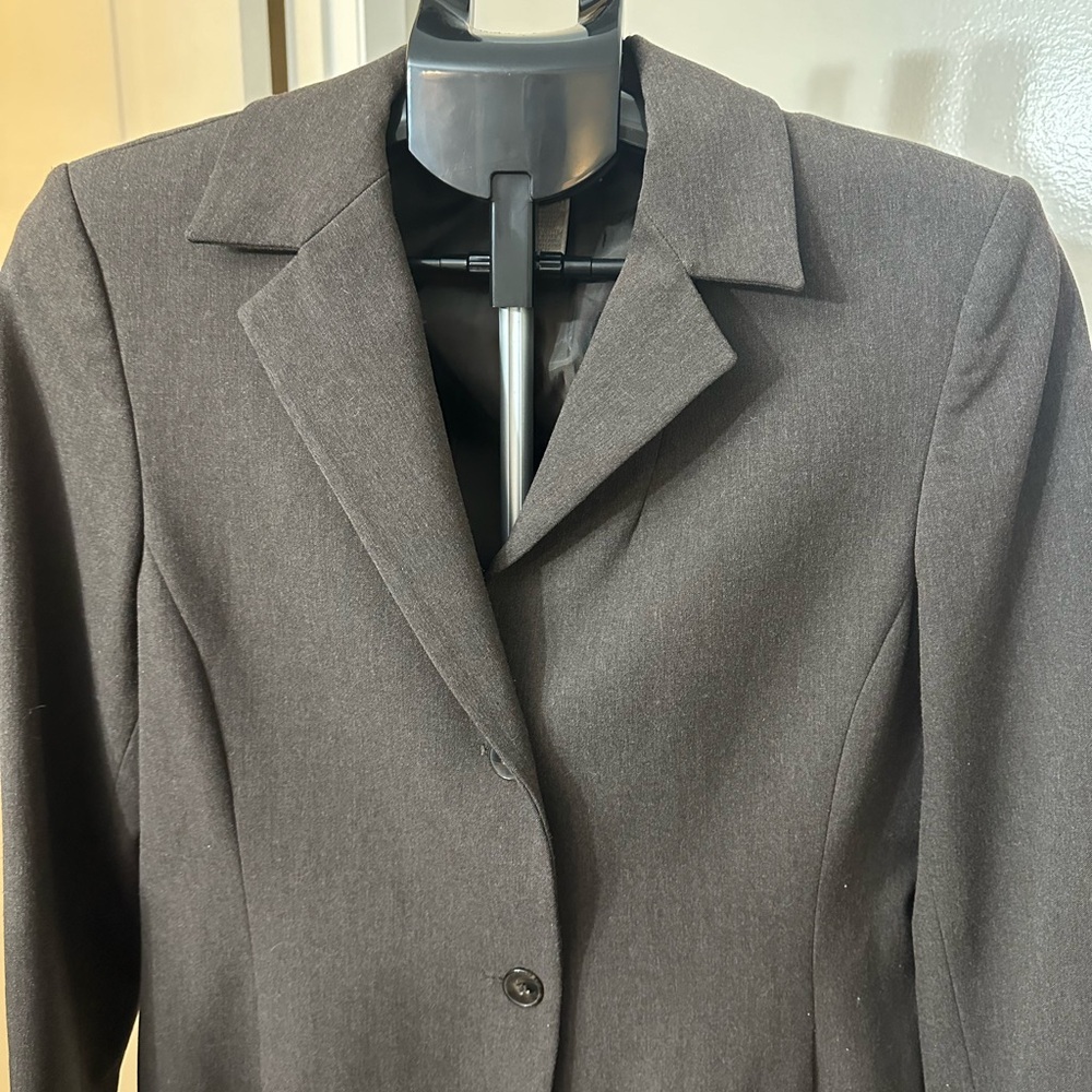 Brown lined  blazer with shoulders pads.
